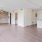 Large well lit living room with wood floors 