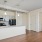 Large well lit dining area with wood floors